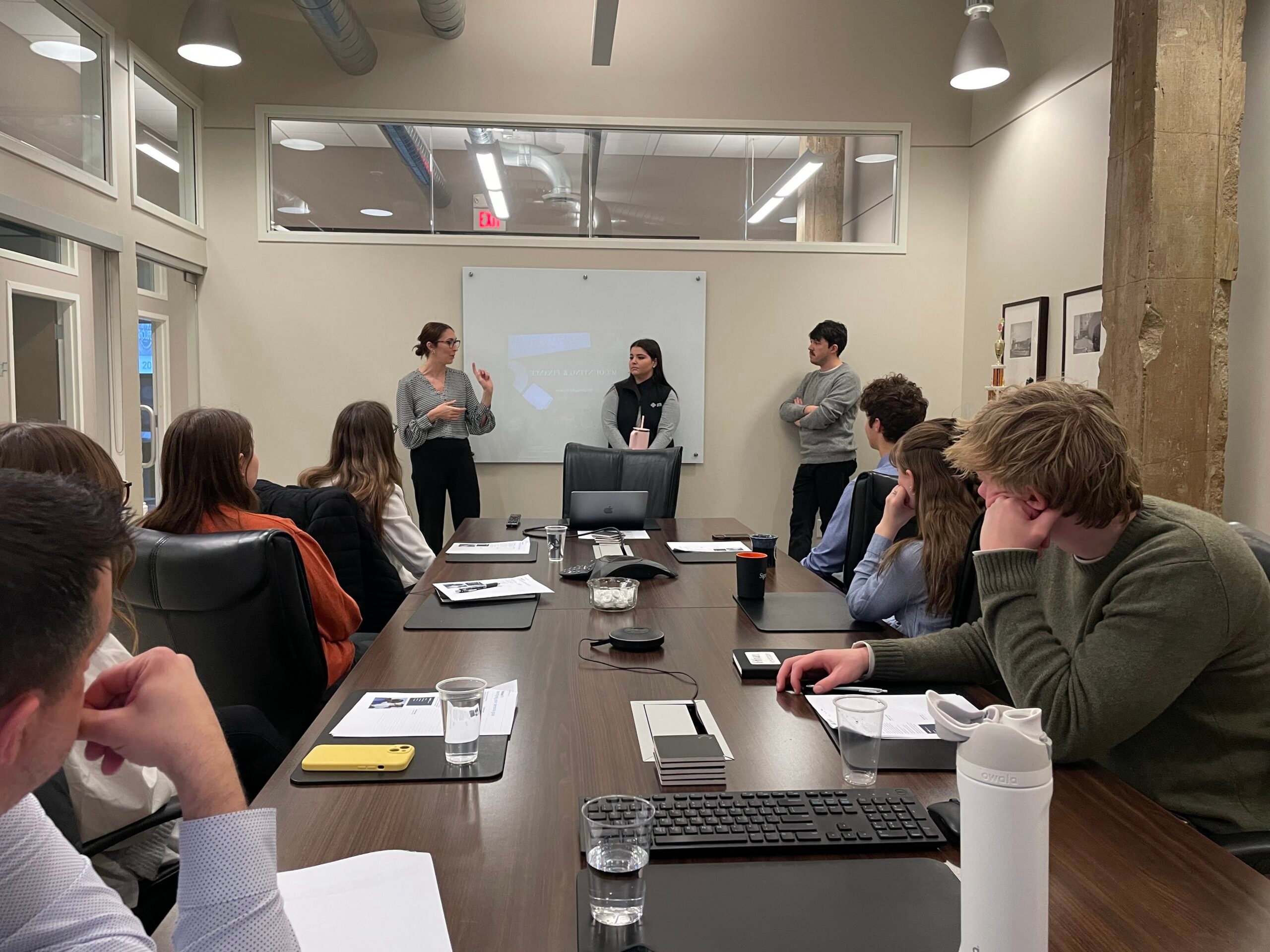 students in a meeting room practicing stewardship