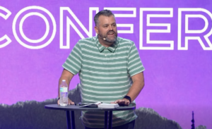 Keith Miller speaking at Momentum Youth Conference 2026.